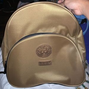 Gold versace perfume backpack